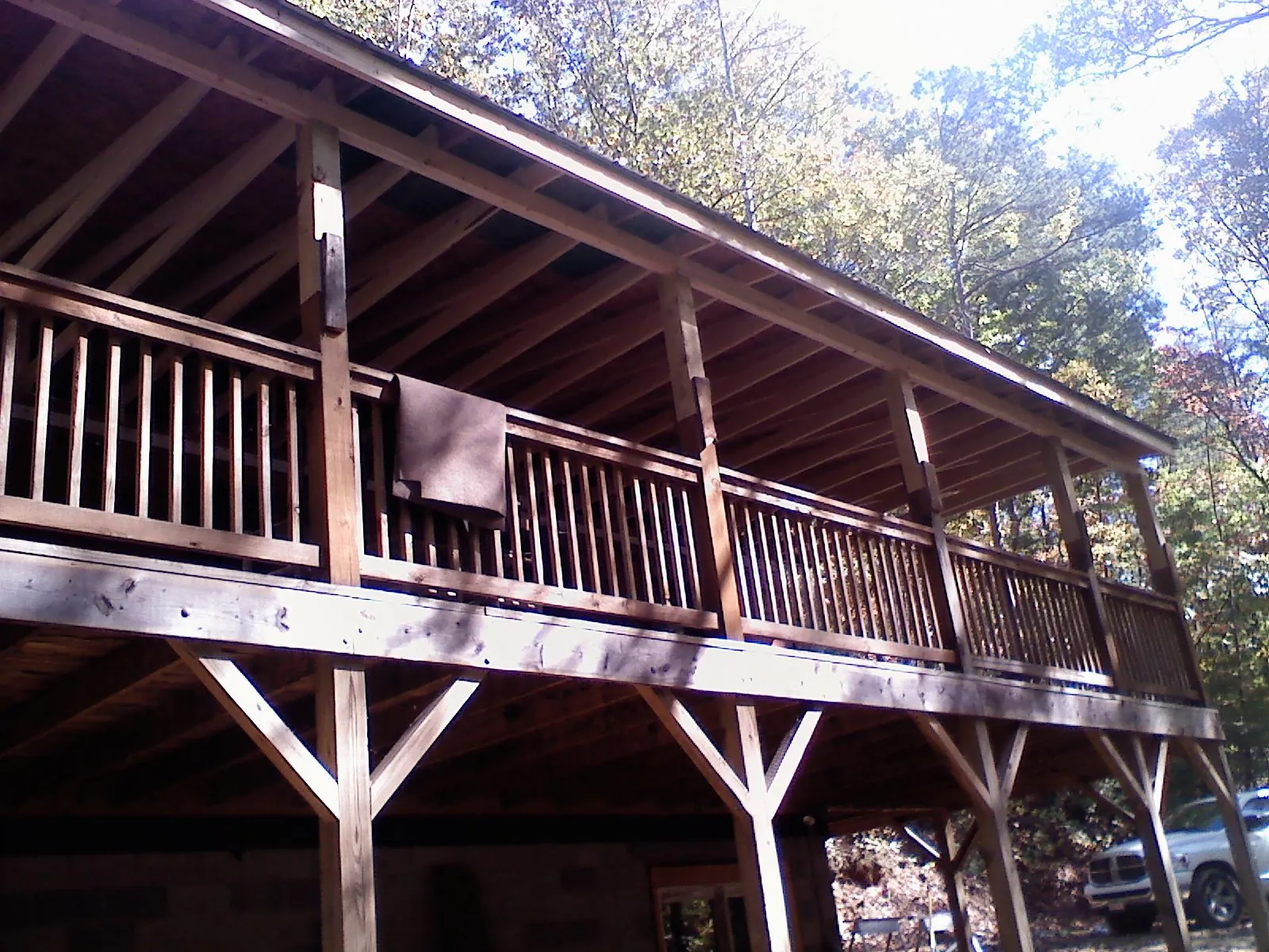Timber framing under a new elevated porch and deck — Roof Leak Repair in Mercersburg by Roofing Brothers